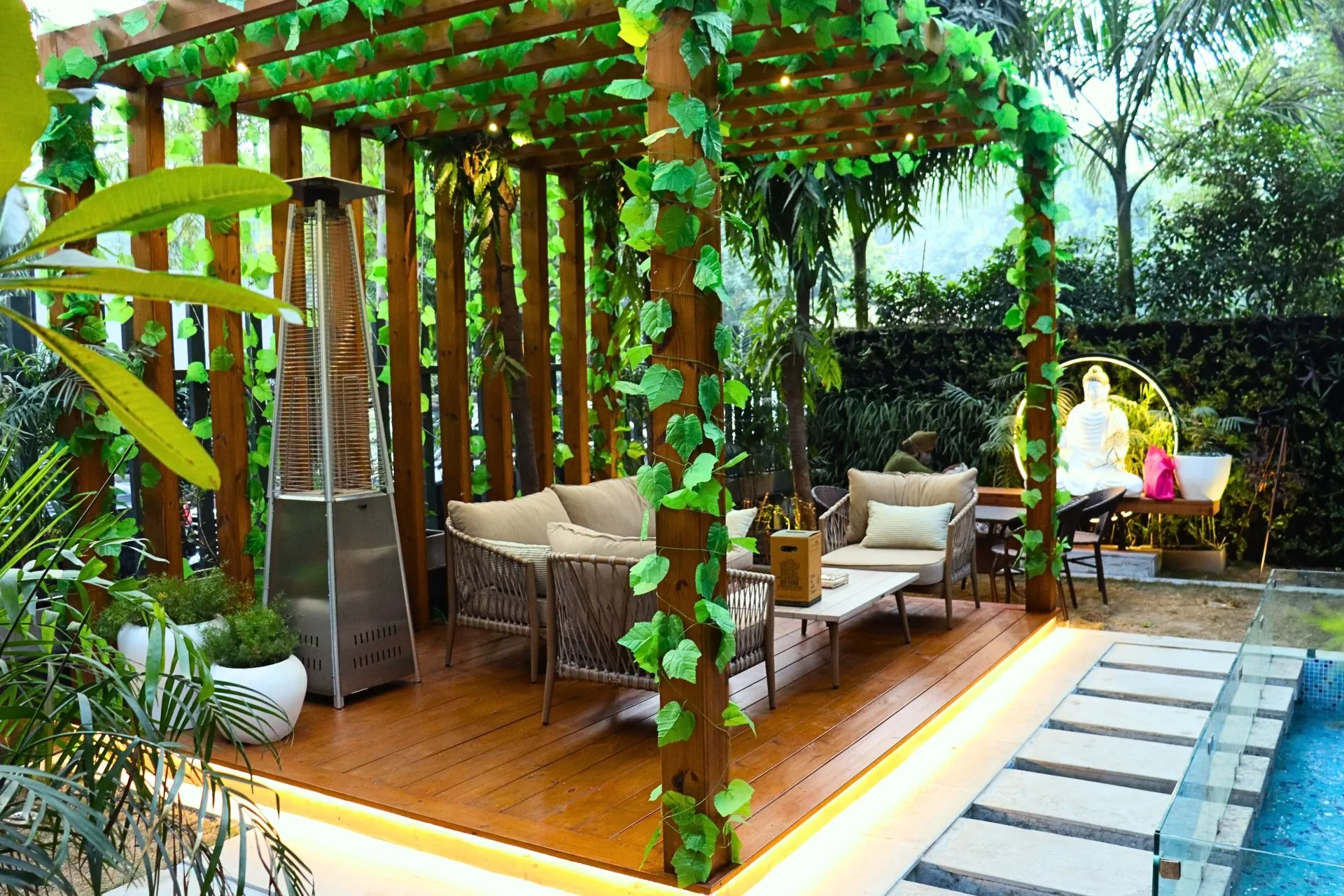 Pergola with climbers, deck and vertical garden built by LifeWall